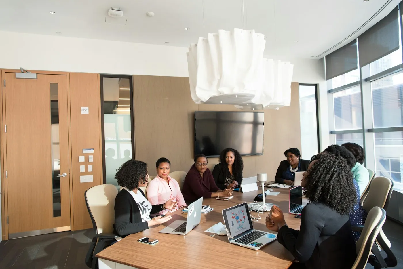 Colleagues working together around a table in a bright office